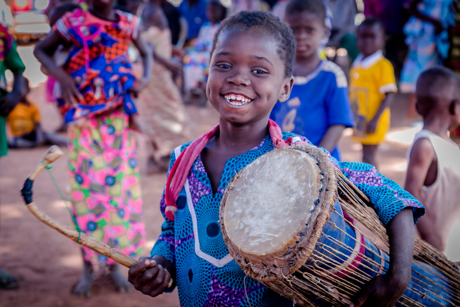 Children in Ghana learning to play drums